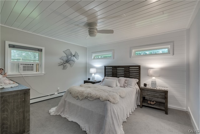 bedroom featuring a baseboard heating unit, multiple windows, light carpet, and ceiling fan