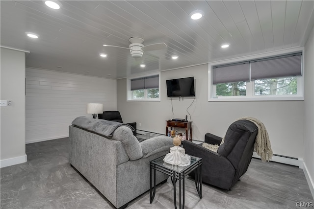 living room with concrete flooring, a baseboard radiator, ceiling fan, and wooden ceiling