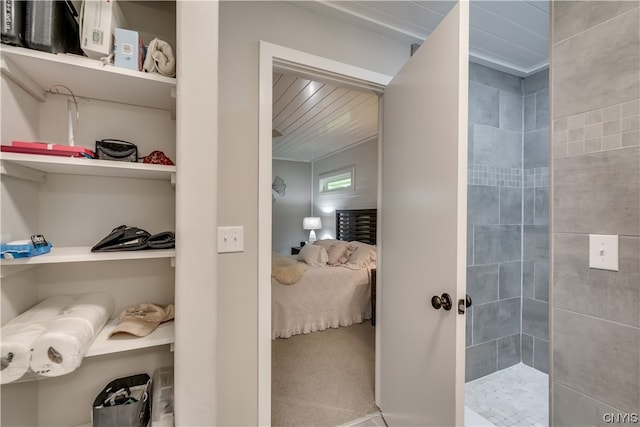 interior space featuring a tile shower