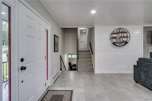 entrance foyer with light tile floors and baseboard heating