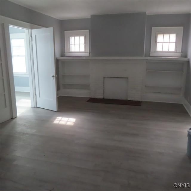 unfurnished room featuring dark wood-style floors