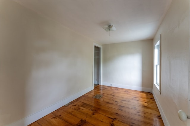 spare room with light hardwood / wood-style flooring