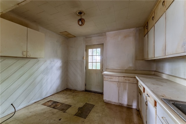 kitchen featuring light tile flooring and sink