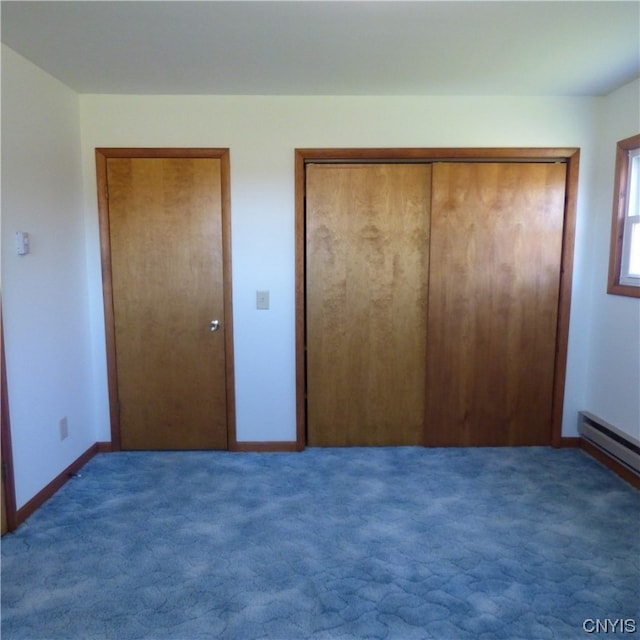 unfurnished bedroom featuring dark carpet