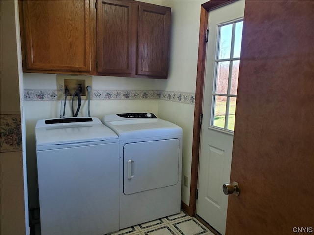 laundry area with light tile flooring, washer hookup, independent washer and dryer, and cabinets