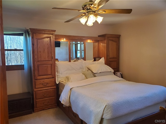 bedroom with ceiling fan and carpet