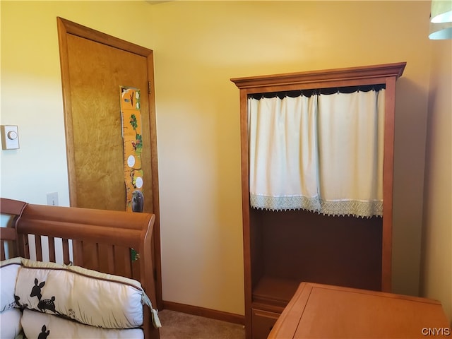 bedroom featuring dark carpet