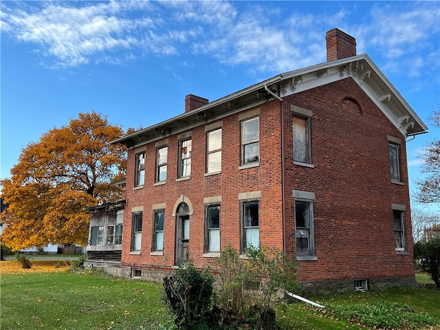 view of home's exterior featuring a yard