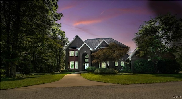 view of front of home with a lawn