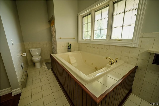 bathroom with toilet, tile patterned flooring, baseboard heating, and a tub