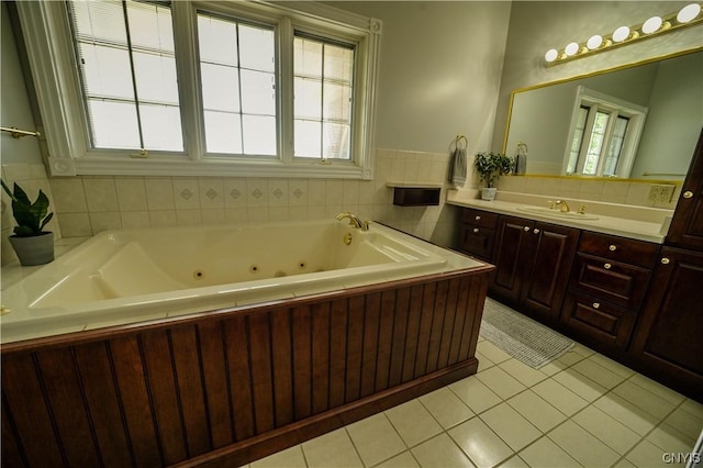 bathroom featuring a washtub, vanity, and tile patterned floors