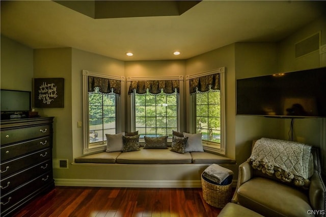 sitting room with dark hardwood / wood-style flooring