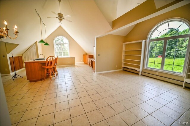 additional living space with lofted ceiling, ceiling fan with notable chandelier, and light tile patterned floors