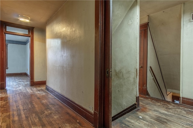 corridor with dark wood-type flooring