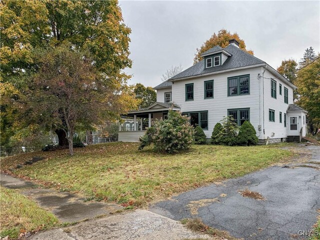 12 Academy St, Antwerp, NY 13608 - view of side of property featuring a chimney and a yard