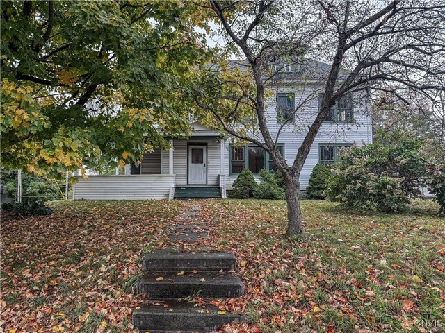 12 Academy St, Antwerp, NY 13608 - view of property hidden behind natural elements with a porch