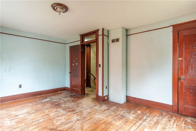 unfurnished bedroom featuring light wood-type flooring