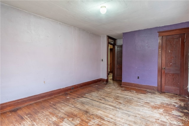 empty room with wood-type flooring