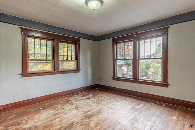 spare room with hardwood / wood-style floors