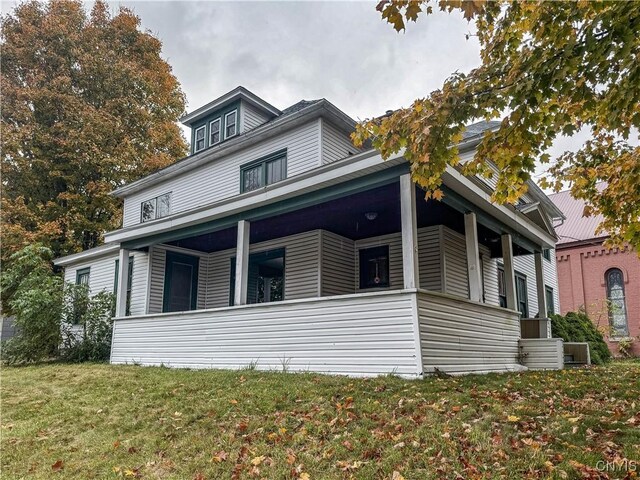 12 Academy St, Antwerp, NY 13608 - view of side of property featuring a porch and a yard