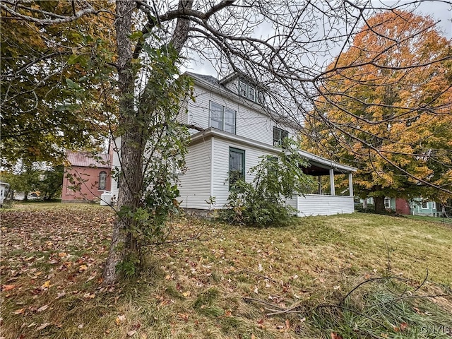 view of property exterior featuring a yard