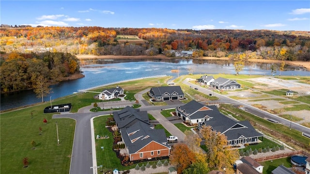 birds eye view of property with a water view