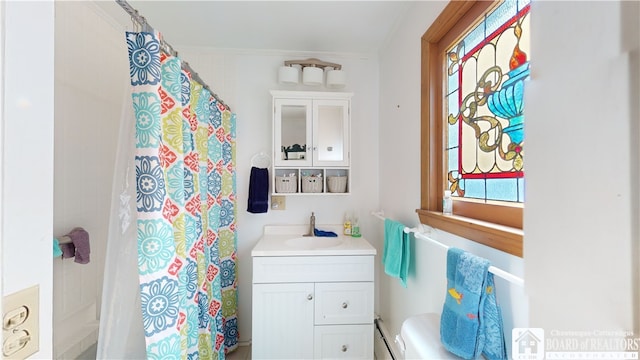 bathroom with oversized vanity and ornamental molding