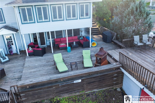 wooden deck featuring outdoor lounge area