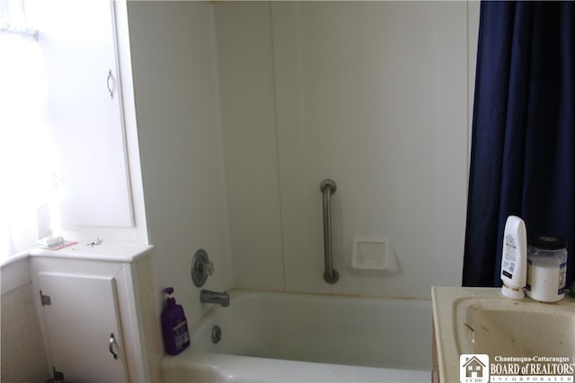 bathroom featuring vanity and shower / washtub combination