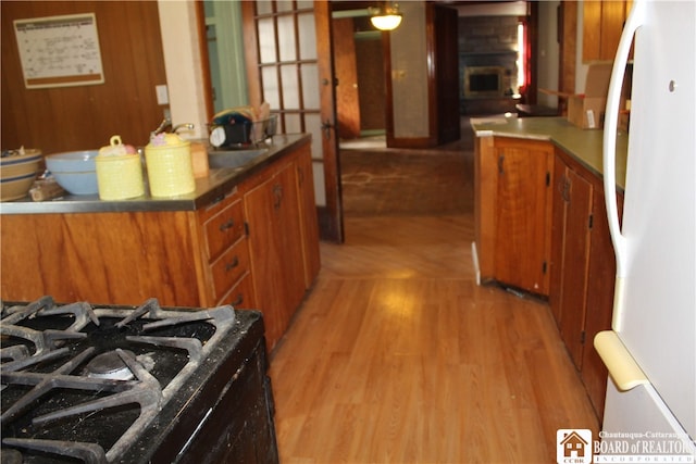 kitchen featuring white fridge and light wood-type flooring