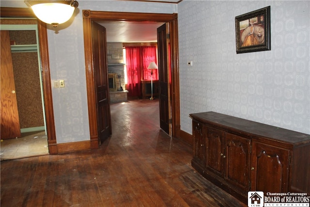 hall with dark wood-type flooring