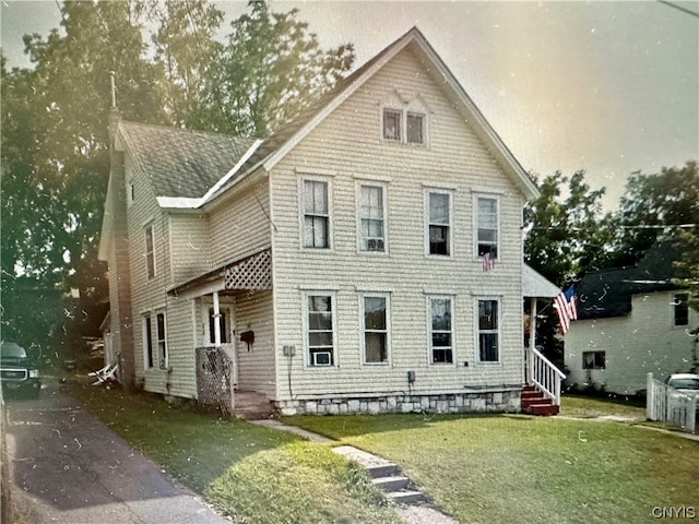 view of front of home with a front lawn