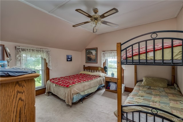 bedroom featuring ceiling fan, light carpet, and vaulted ceiling