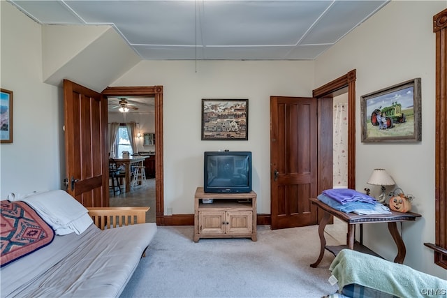 interior space featuring light colored carpet and ceiling fan