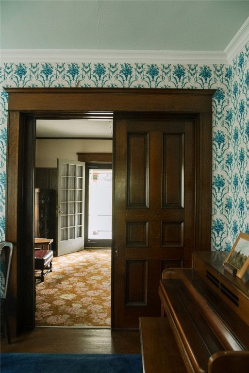 interior space featuring crown molding and dark hardwood / wood-style floors