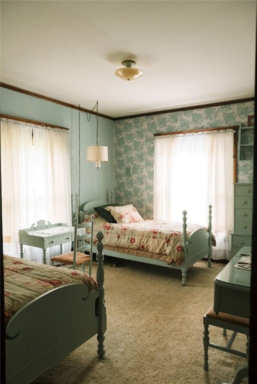 carpeted bedroom with multiple windows and crown molding