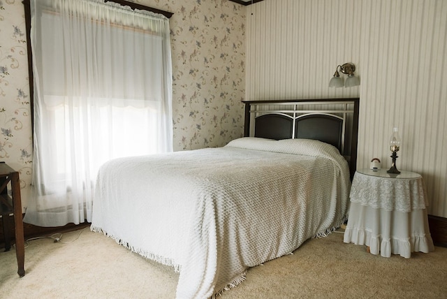 bedroom featuring light colored carpet