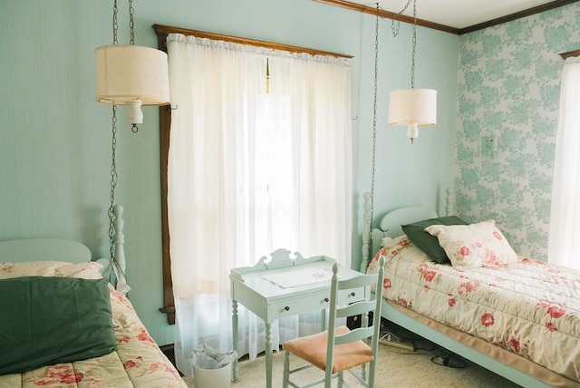 carpeted bedroom with ornamental molding