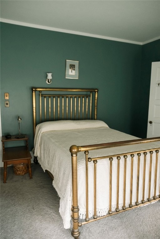 carpeted bedroom with ornamental molding