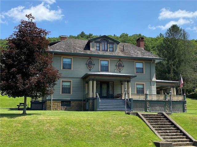 view of front of house featuring a porch and a front lawn