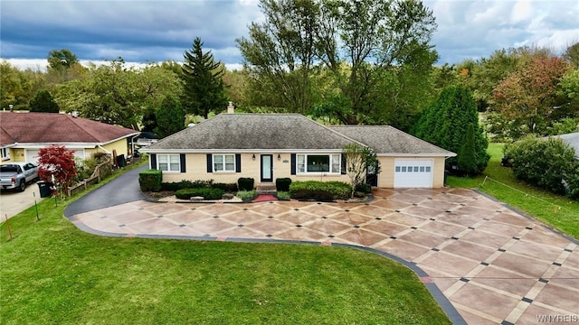 single story home featuring a front lawn and a garage