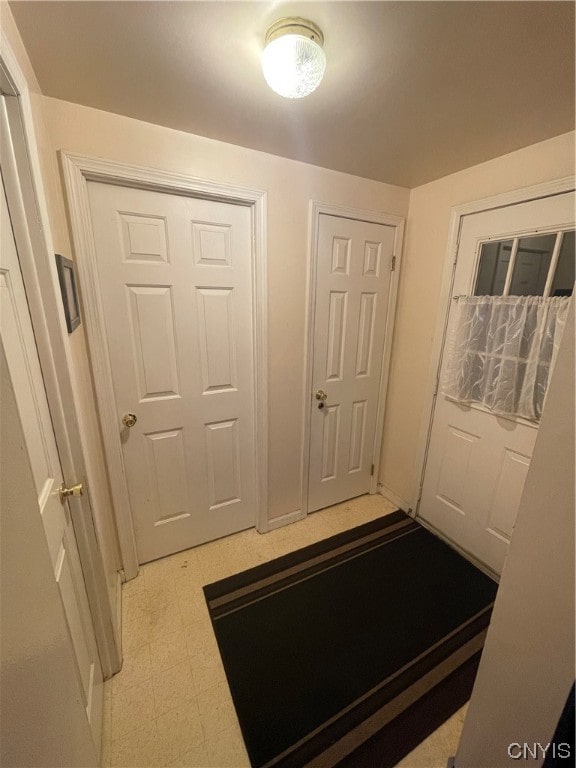 interior space featuring light tile floors