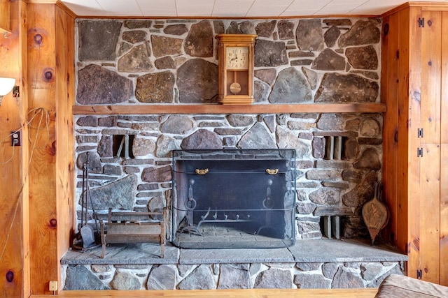 details with a stone fireplace