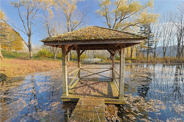 dock area with a water view and a gazebo