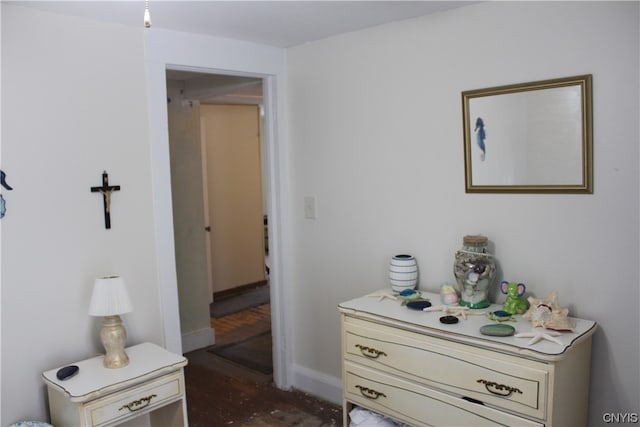 bedroom featuring dark hardwood / wood-style flooring