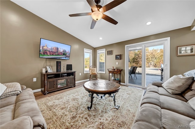 living room with vaulted ceiling, ceiling fan, and hardwood / wood-style flooring