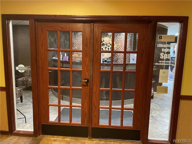 doorway with light tile flooring