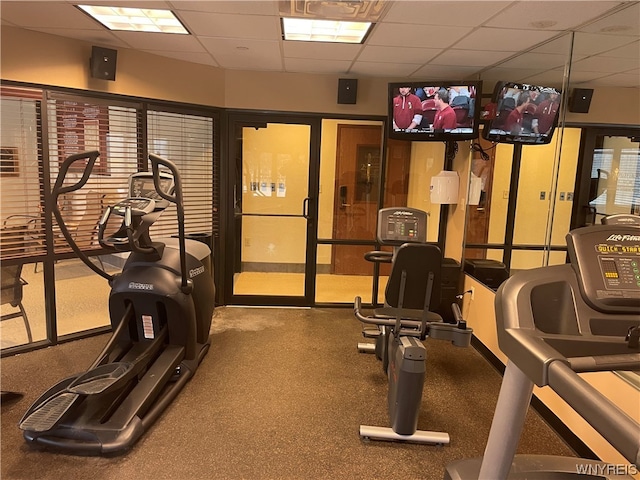 gym featuring a paneled ceiling