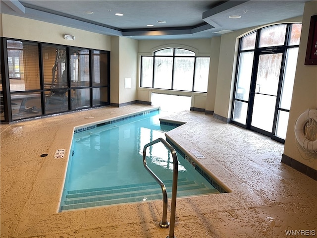 view of pool with a jacuzzi