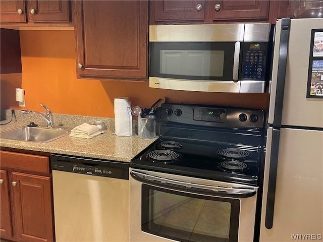 kitchen featuring appliances with stainless steel finishes and sink